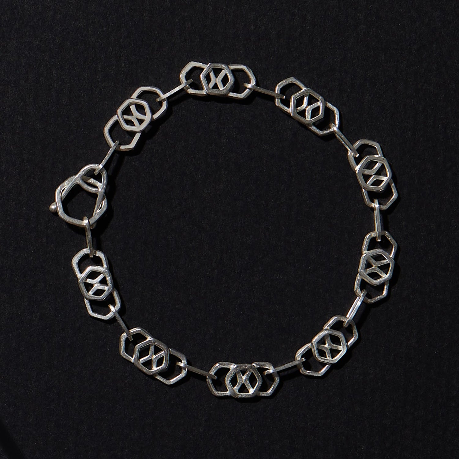 Handmade chain bracelets with geometric designs